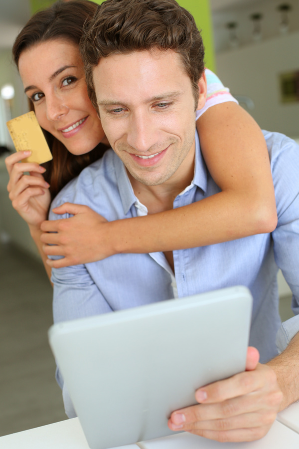 Couple using laptop for online payment Stock Photo 02