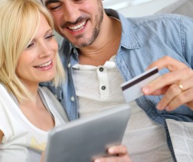 Couple using laptop for online payment Stock Photo 03