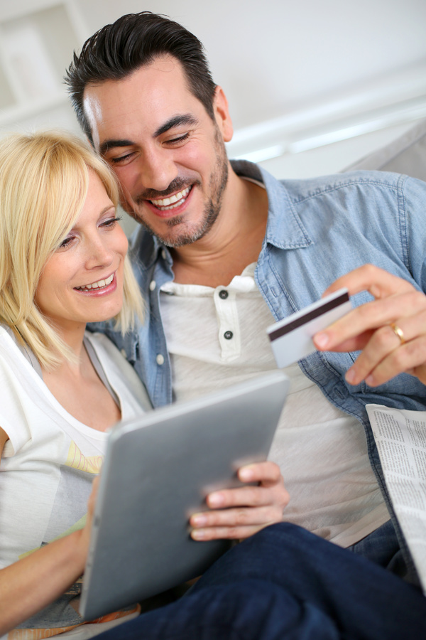 Couple using laptop for online payment Stock Photo 03