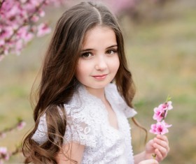 Cute girl holding a flower Stock Photo 02