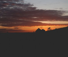 Dark sunset on hill Stock Photo