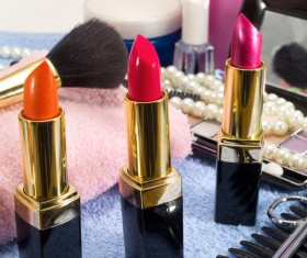 Different colors of lipstick and powder box Stock Photo