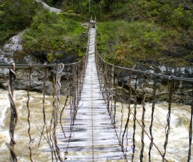 Dilapidated suspension bridge Stock Photo