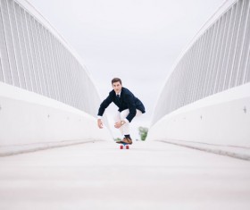 Elegant mens play skateboard Stock Photo