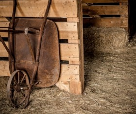 Farmhouse rusty wheelbarrow Stock Photo