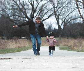 Father accompanied his daughter to run Stock Photo