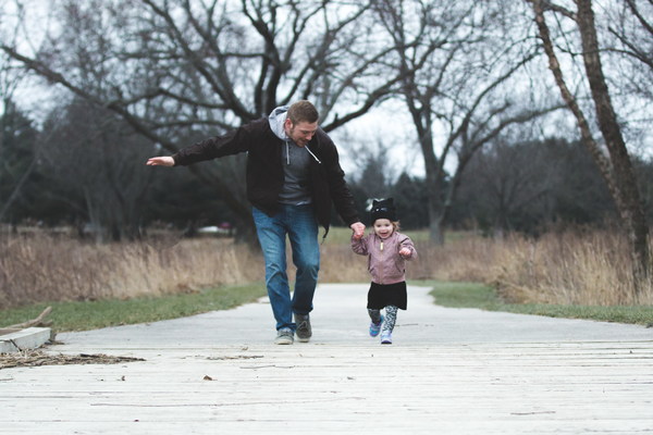 Father accompanied his daughter to run Stock Photo
