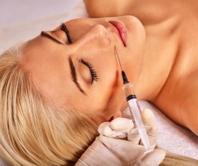 Female facial botulinum injection Stock Photo