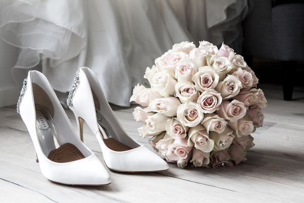 Female high heels and bouquet Stock Photo