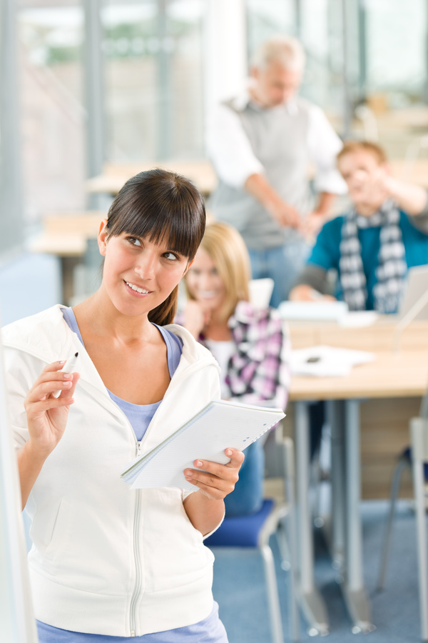 Female students in college classroom Stock Photo