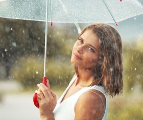 Girl holding an umbrella on rainy day Stock Photo