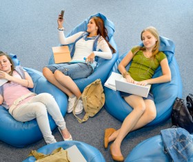 Girl sitting in inflatable chair Stock Photo 01