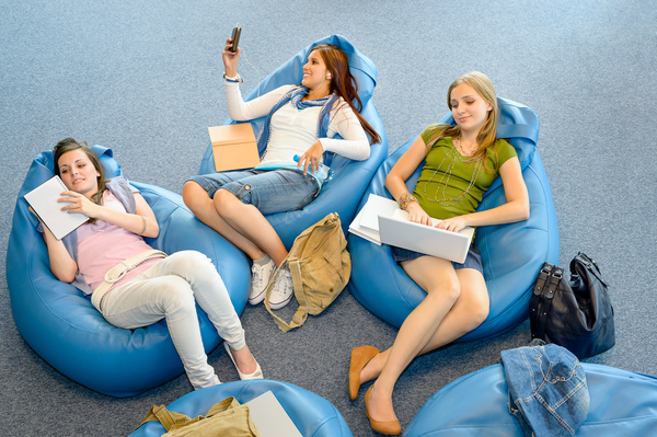 Girl sitting in inflatable chair Stock Photo 01