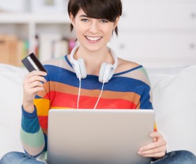Girl using laptop for online payment Stock Photo 01