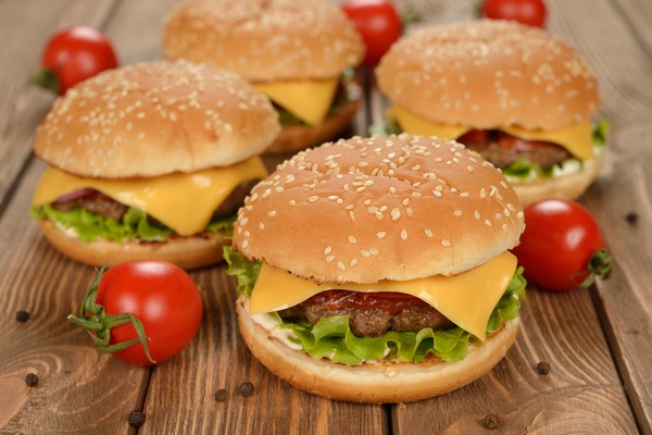 Hamburger and tomato on the desktop Stock Photo