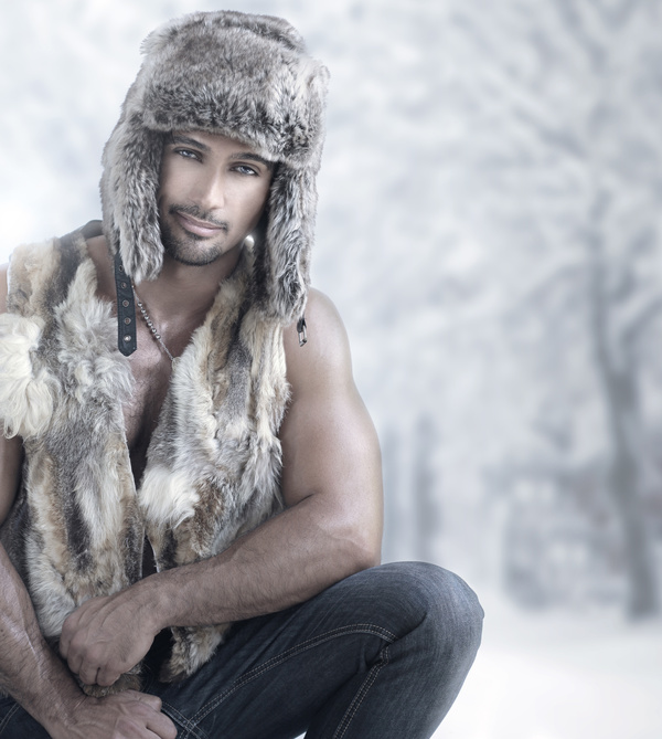 Handsome male wearing furs Stock Photo