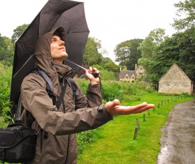 Happy man on rainy day Stock Photo