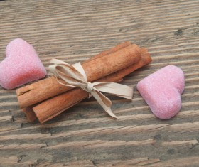 Heart shaped candy and cinnamon Stock Photo