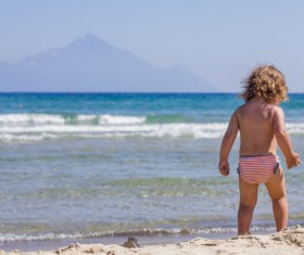 Kid playing on the beach Stock Photo