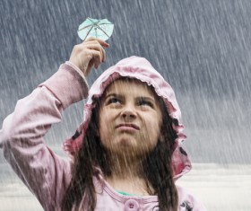 Little girl in the rain Stock Photo