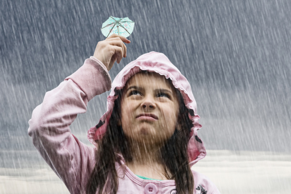 Little girl in the rain Stock Photo