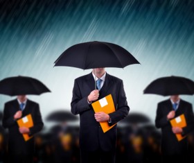 Man holding an umbrella holding folder Stock Photo