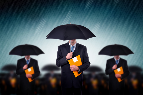 Man holding an umbrella holding folder Stock Photo