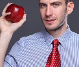Man holding apple Stock Photo