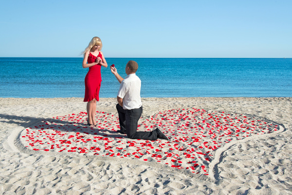 Man on the beach Marriage proposal Stock Photo