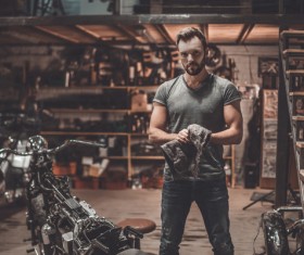 Man repairing motorcycle Stock Photo 03