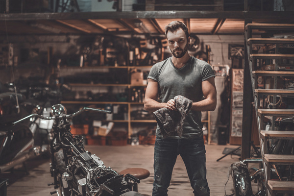 Man repairing motorcycle Stock Photo 03
