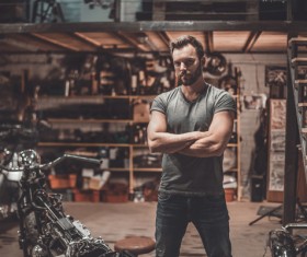 Man repairing motorcycle Stock Photo 04