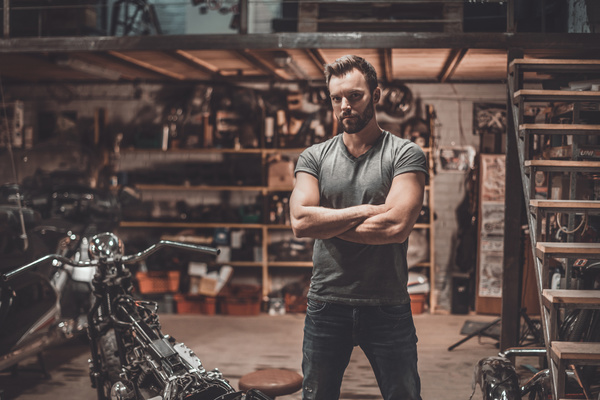 Man repairing motorcycle Stock Photo 04