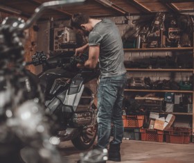 Man repairing motorcycle Stock Photo 05