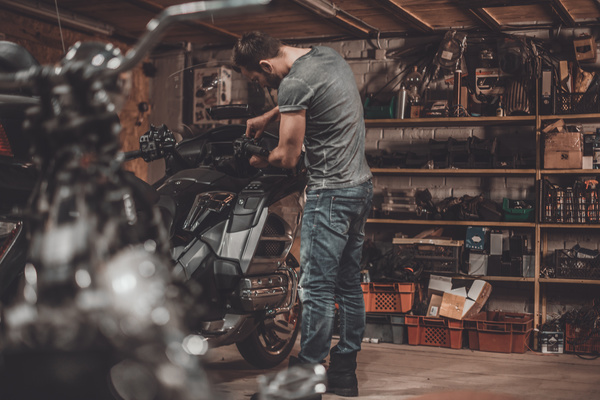 Man repairing motorcycle Stock Photo 05