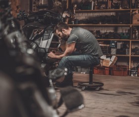 Man repairing motorcycle Stock Photo 06