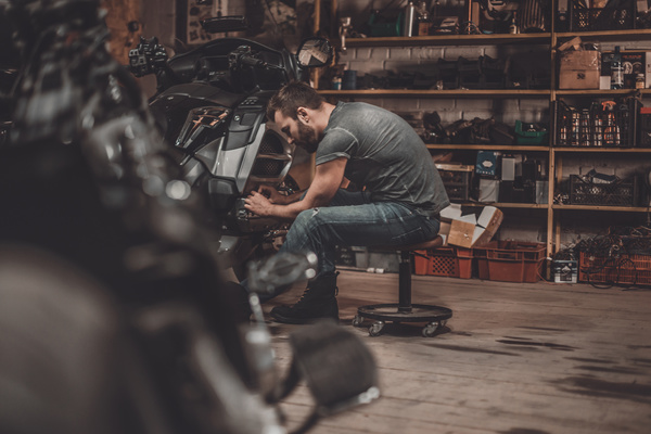 Man repairing motorcycle Stock Photo 06