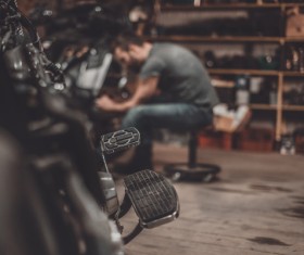 Man repairing motorcycle Stock Photo 07