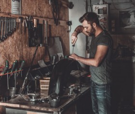 Man repairing motorcycle Stock Photo 08