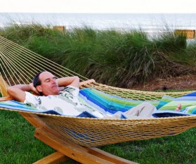 Man resting in hammock Stock Photo 01