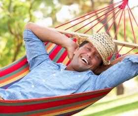Man resting in hammock Stock Photo 02