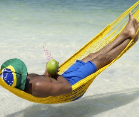 Man resting in hammock Stock Photo 03