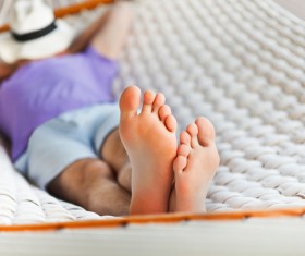 Man resting in hammock Stock Photo 04