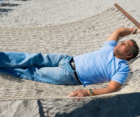 Man resting in hammock Stock Photo 05