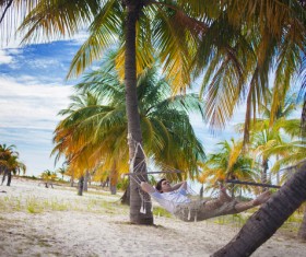 Man resting in hammock Stock Photo 06