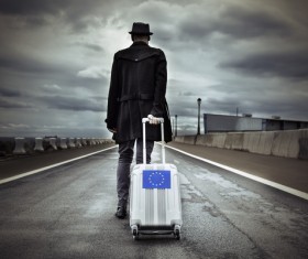 Man traveling with suitcase Stock Photo