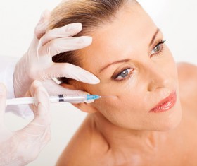 Middle-aged female facial botox injection Stock Photo 01
