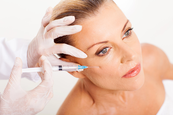 Middle-aged female facial botox injection Stock Photo 01
