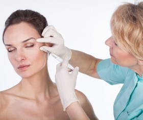 Middle-aged female facial botox injection Stock Photo 02