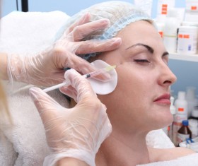 Middle-aged female facial botox injection Stock Photo 03